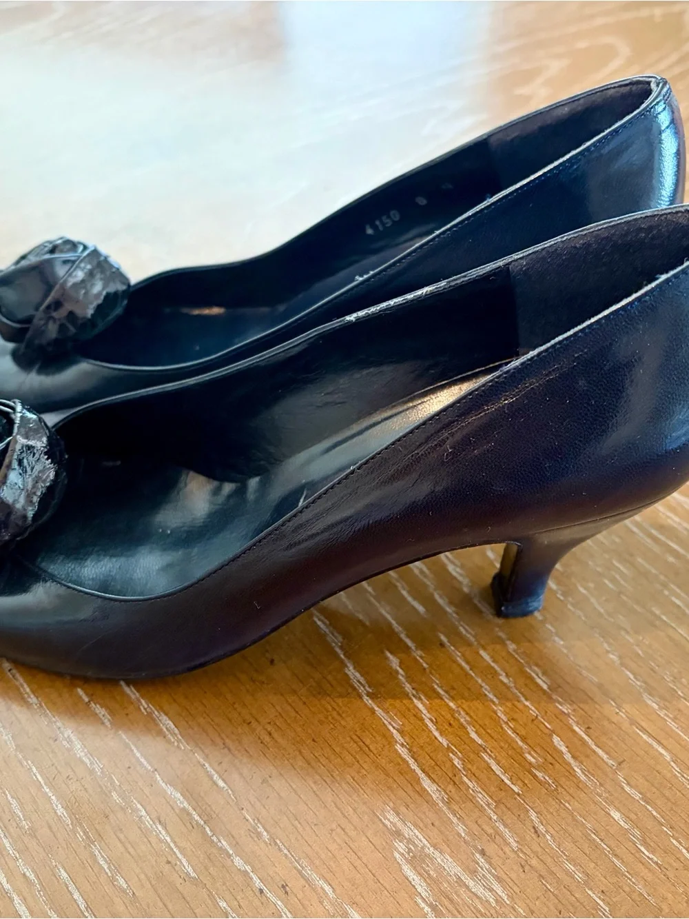 Stuart Weitzman Black Pointed Toe Pumps with Rosette